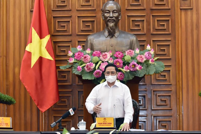 Thủ tướng Chính phủ Phạm Minh Chính tại cuộc họp của Thường trực Chính phủ về phòng chống Covid-19 chiều 24/5 - Ảnh: VGP